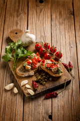 italian bruschetta with hot chili peppr caper garlic and oregano