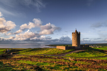 Fototapeta na wymiar Doonagore castle at sunset, Co. Clare, Ireland
