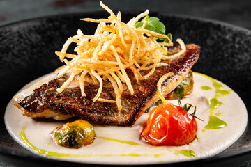 Fried fillet dorado fish with sauce