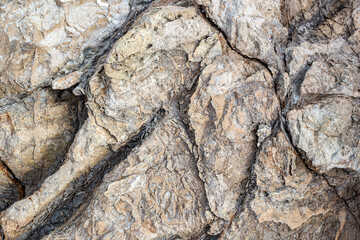 Background of stone wall texture. Close-up of stone surface.