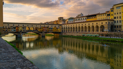 Firenze city skyline, buildings, and beautiful cityscape with the view of Ponte Vecchio, the medieval arched bridge with Roman origins over the Arno River in Florence