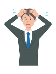 頭を抱えるビジネスマン
