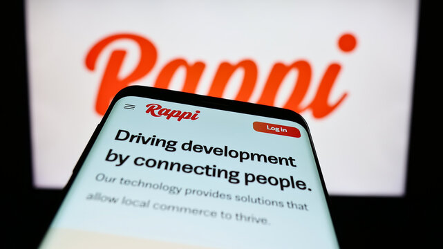 Stuttgart, Germany - 04-02-2023: Mobile phone with website of Colombian food delivery company Rappi Inc. on screen in front of business logo. Focus on top-left of phone display.