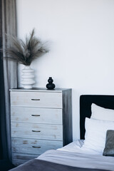 stylish monochrome bedroom interior. black and white furniture and textiles