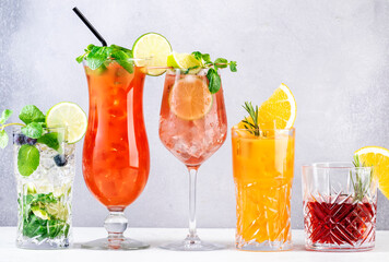 Trendy cocktails set: negroni, blueberry mojito, screwdriver, hurricane and french mule on gray...