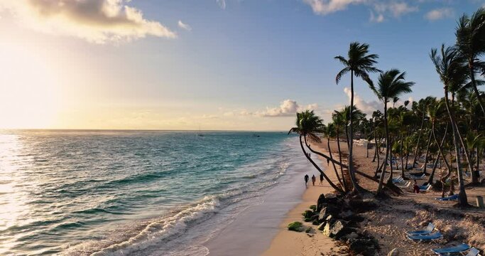 Sunrise over tropical ocean beach and caribbean sea. Aerial view of playa Bavaro, Punta Cana, Dominican Republic 4k video