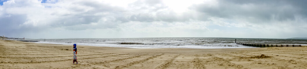 Fototapeta na wymiar A view along Alum Chime beach at Bournemouth, Dorset, UK in April 2023