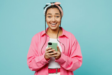 Young surprised shocked woman of African American ethnicity wears pink shirt white t-shirt...