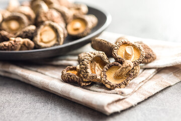 Dried shiitake mushrooms on kitchen table.