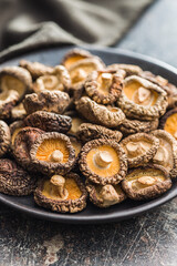Dried shiitake mushrooms on kitchen table.