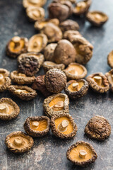 Dried shiitake mushrooms on kitchen table.