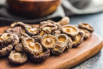 Dried shiitake mushrooms on kitchen table.