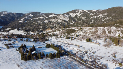  A rare Winter snow covers the orchards, vineyards and farmland around Julian California.