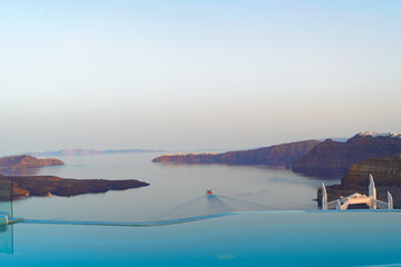 Aegan sea and view of Santorini caldera with boats and ferries, Greece