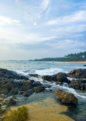 Fototapeta na wymiar Beautiful tropical landscape on the ocean shore of Sri Lanka. Photography for tourism background, design and advertising.