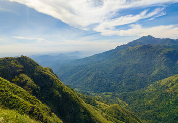 Beautiful mountain tropical landscape with green hills and blue sky. Photography for tourism background, design and advertising.