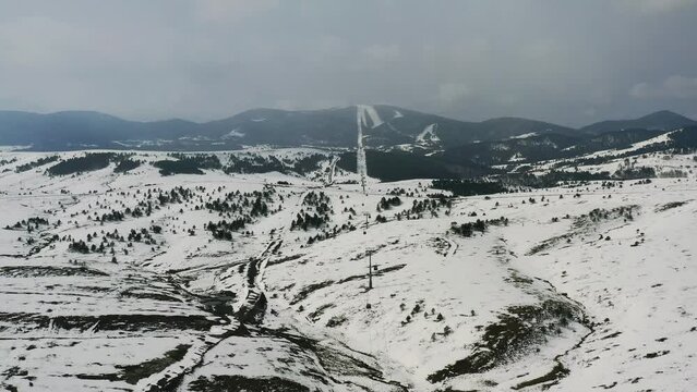 Aerial view of cable cars (gondola lifts) moving between Zlatibor and Tornik