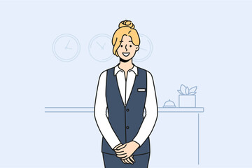 Smiling female receptionist in uniform posing at counter in hotel. Happy woman administrator working at reception. Vector illustration.  - obrazy, fototapety, plakaty