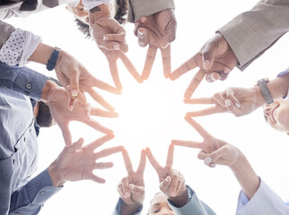 Business people, hands together and peace sign in teamwork or unity forming a star for...