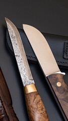 Damascus steel knives on a black background. Kitchen knives. background with japanese knife. A set...