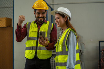 Warehouse worker checking and loading or unloading boxes in a large distribution warehouse.