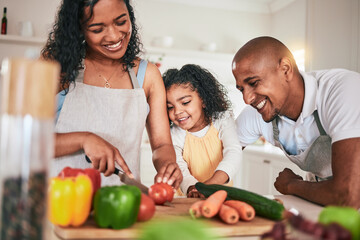 Family, cut and cooking vegetables together or learning chef skill with parents and child in...