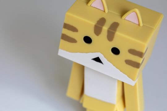 Closeup of a tiger colored Danbo Toy on white background