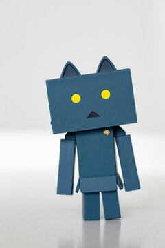 Front view of a blue Danbo Toy on white background