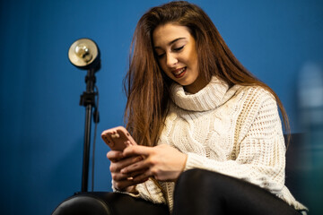 A young woman rests on the couch