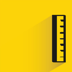 ruler with shadow on yellow background