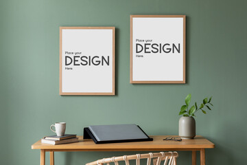 Creative composition of home office space with two wooden frames, stylish desk, chairs, plant, laptop and office accessories. Home decor. Template.