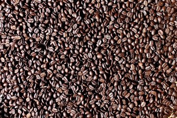 Roasted coffee beans background, Top view of brown coffee beans, Texture freshly roasted coffee beans. - 592228841