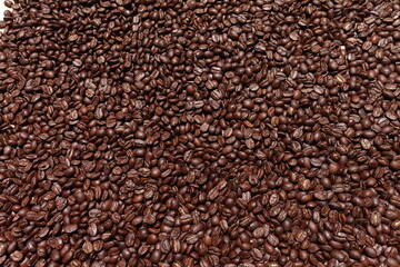 Top view of brown coffee beans, Roasted coffee beans background, Texture freshly roasted coffee beans. - 592229096