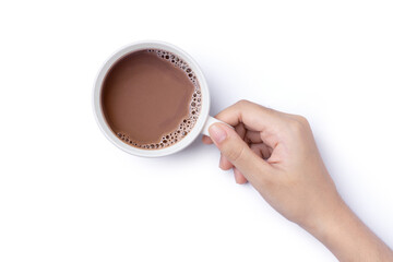 Hand hold cup of hot chocolate cocoa drink isolated on white background. Top view. Flat lay. 