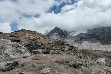 Beautiful view of rocky cliffs under big clouds