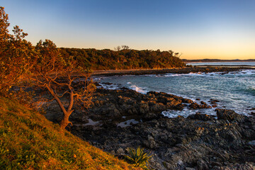 beautiful sunrise on the rocky beach in yuraygir national park, new south wales, australia