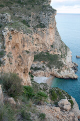 Landscape at Moraig Cove Beach with Cliff; Alicante; Spain - 592233406