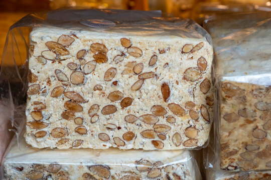 Traditional nougat on black plate. Selective focus