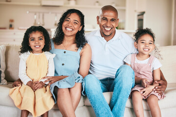 Family in portrait, parents and happy children relaxing at home in support, love or bonding together on sofa. Happiness, people or living room with relationship or spending quality time on a weekend