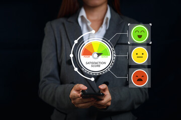  Happy customer asian woman pressing on online application meter screen with excellent 5.0 rating for service evaluation on smartphone virtual screen. Customer satisfaction survey experience concept.