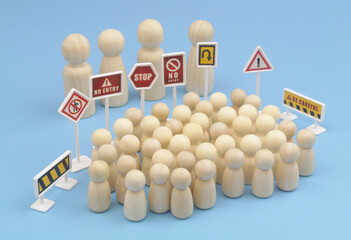 Large people figures and small people figures separated by prohibition signs. Discrimination,...
