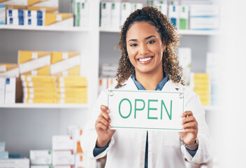 Open sign, medical board and woman portrait in a pharmacy with a billboard. Working, pharmacist poster and healthcare worker with a smile from retail store opening for pill and medicine shop