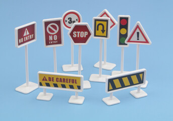 Close up of traffic signs on blue background.