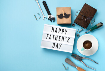 Fathers day Card with Gift Box, Moustache, Cup of Coffee and Glasses on Blue Background