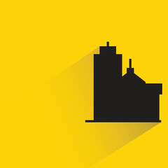 Obraz premium silhouette city building with shadow on yellow background