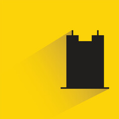 office tower with shadow on yellow background