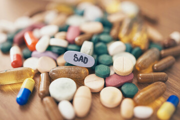 Healthcare, depression or table with medicine pills or supplements products at drugstore clinic. Pharmaceuticals background, blur or medical vitamins, stress anxiety tablets or sad medication closeup