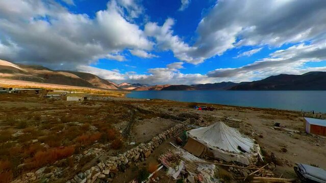 Time lapse of Captivating Clouds over Pangong Lake with Sun Rays and Mountain Range