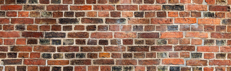 dark texture of old red bricks wall background