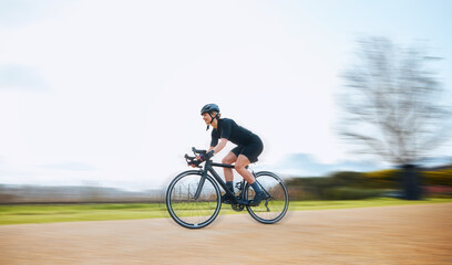 Cycling, motion blur and fitness with woman in nature and mockup for speed, workout and challenge. Exercise, fast and travel with female cyclist riding on bike for journey, adventure and cardio